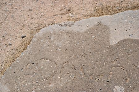 Dawn. Who was she? What became of her? Child's scrawl in fresh concrete, Wonder Valley, California.