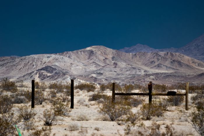 The environment becomes more or less lunar at midday, and a space suit to ensure survival would not seem completely out of place here in Wonder Valley, California.