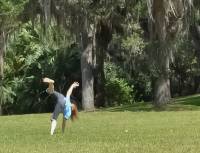 Lisa, turning cartwheels at Bok Tower, Florida.