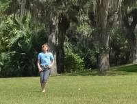 Lisa, turning cartwheels at Bok Tower, Florida.