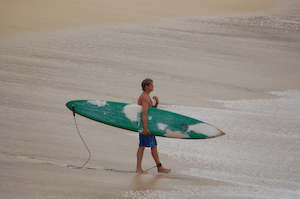 Making the sign of the cross, just prior to entering the water at Waimea Bay.